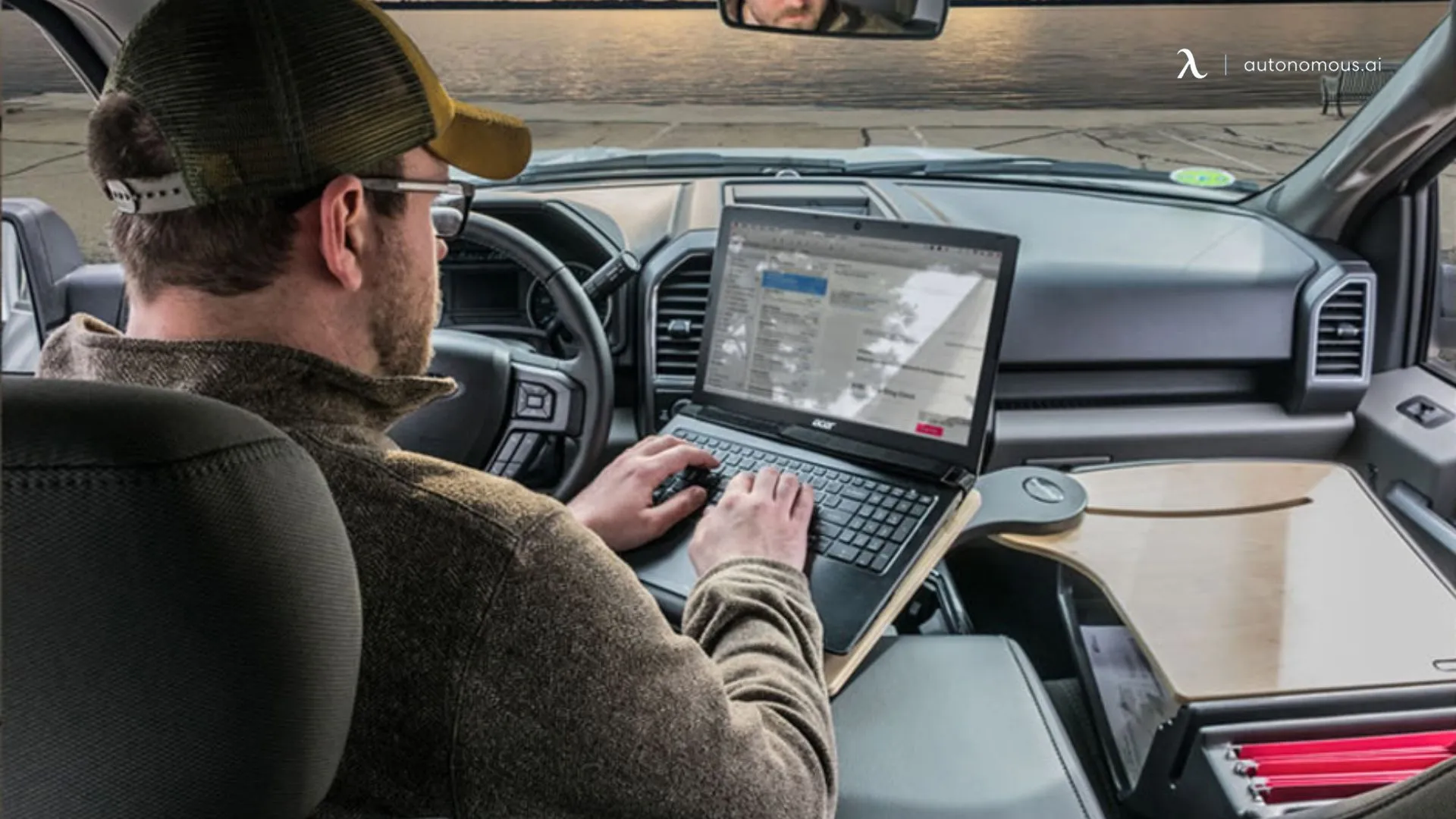 Mobile workspace inside a truck with a laptop used for operations and field coordination.